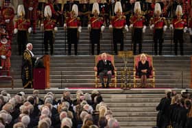 King Charles III and the Queen Consort listen to Speaker of the House of Lords Lord McFall of Alcluith (left) at Westminster Hall. Credit: PA