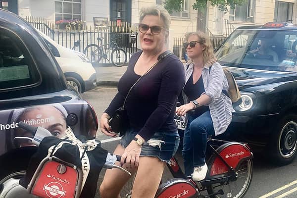 Suzy Eddie Izzard was spotted by a delighted fan careering around London on a Boris bike.