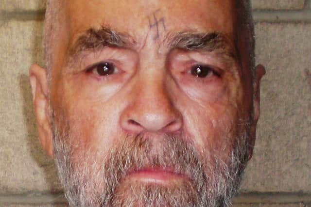  In this handout photo from the California Department of Corrections and Rehabilitation, Charles Manson, 74, poses for a photo on March 18, 2009 at Corcoran State Prison, California. Manson is serving a life sentence for conspiring to murder seven people during the "Manson family" killings in 1969.