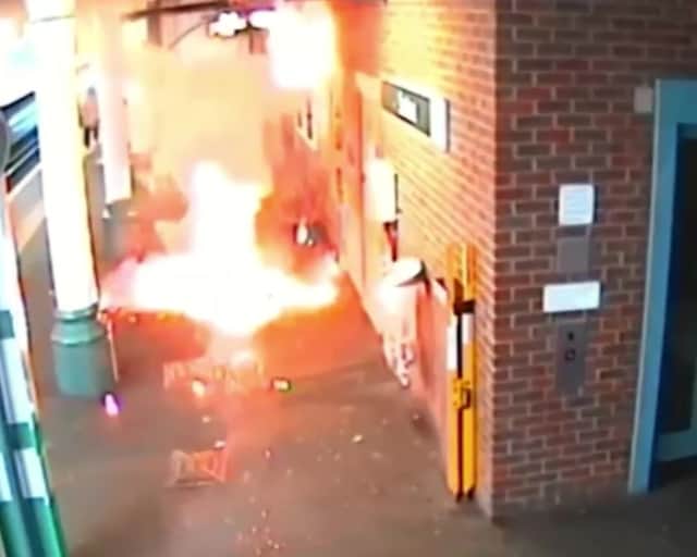 Screengrab of the moment an e-bike exploded, causing a "ferocious" fire - as its owner stood waiting for a train. 