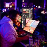 A gamer plays a video game during a Gamescom event. Photo: INA FASSBENDER/AFP via Getty Images