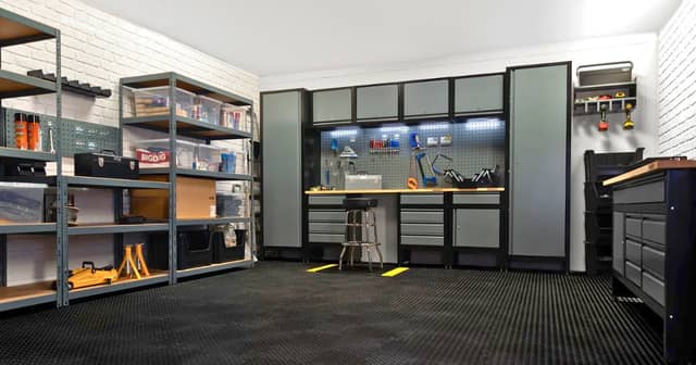 A complete BiGDUG garage setup showing how shelving, cabinets and a workbench can transform a cluttered space into a practical workshop