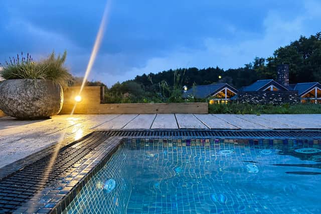 The private outdoor spa pool at Moddershall Oaks comes into its own as evening falls, offering a secluded spot to soak beneath the Staffordshire sky.