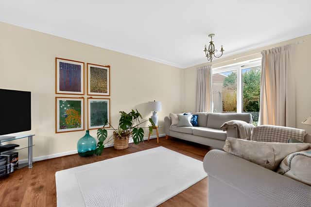 The well-proportioned lounge offers a dedicated setting for relaxing within the spacious family home