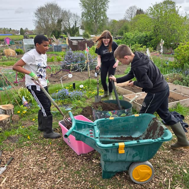 Students working hard as a team at Steven St Allotment