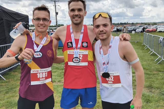 Champion Harvey Speed of Coventry Codiva Harriers flanked by Isaac Walter of Northampton Road Runners Club and Chris Hardy a non-affiliated runner from Grantham.