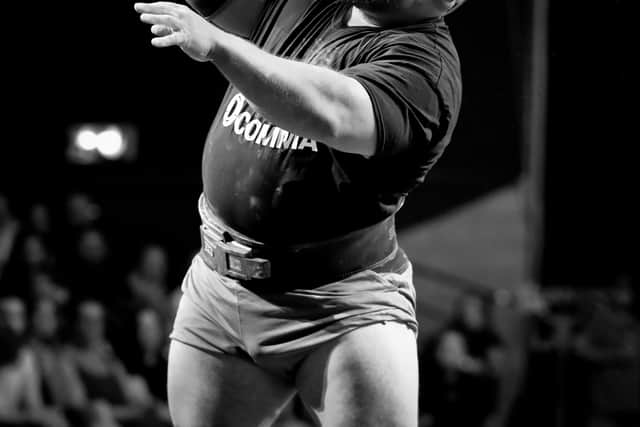 Tom place wrestles with the 110kg monster dumbell!