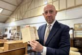 Gildings Auctioneers director Mark Gilding with the Dambusters menu 