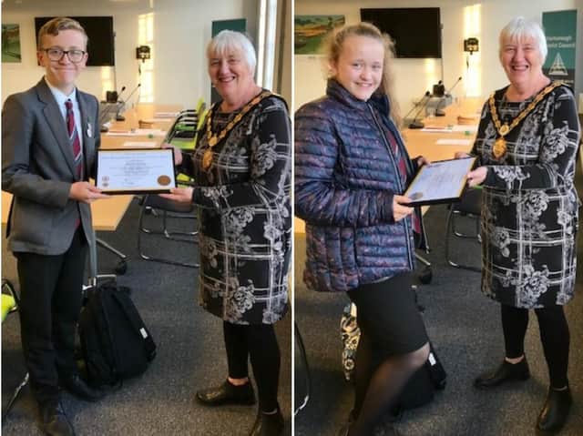 Zara and Mikey Thomas receiving their Lions Club International Young Leaders in Service awards from the chair of Market Harborough District Council Cllr Barbara Johnson. Zara achieved a Silver award for 56 hours community service and Mikey a Bronze award for 27 hours community service.