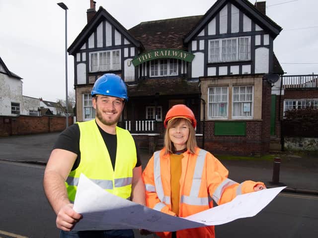 The pub's new operator Andrew Bolley looks at the plans with Railway Arms team member Deb Betts.