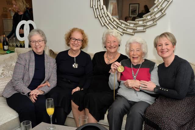 Mary Peters, centre, shows off her gold medal at Elizabeth Place.
PICTURE: ANDREW CARPENTER