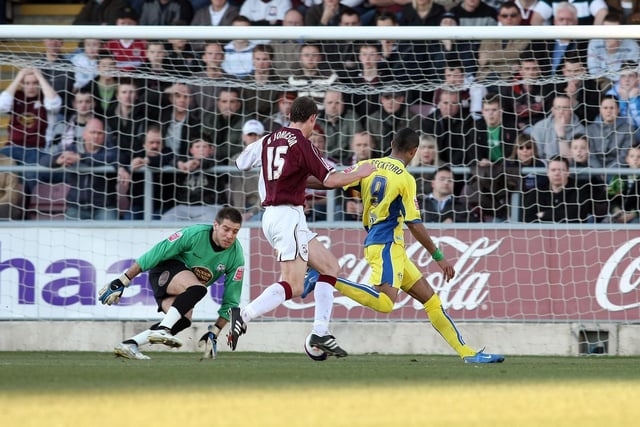 Jermaine Beckford takes the ball past Northampton Town goalkeeper Mark Bunn but misses the target with his shot during the League One clash at the Sixfields Stadium in February 2008.