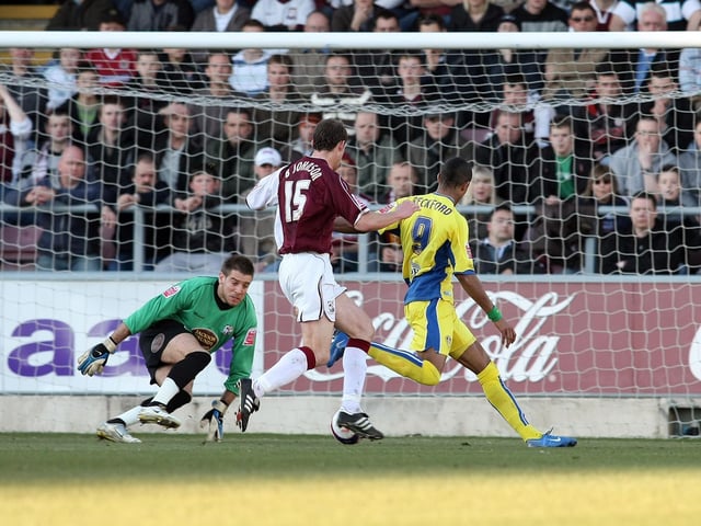 Jermaine Beckford takes the ball past Northampton Town goalkeeper Mark Bunn but misses the target with his shot during the League One clash at the Sixfields Stadium in February 2008.