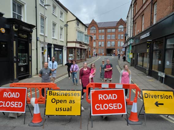 Road closed...shop keepers on Adam & Eve Street want road reopened.
PICTURE: ANDREW CARPENTER