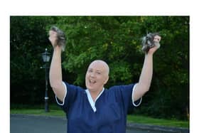 Michele Tate celebrates after her head shave for Macmillan Cancer at the Willows Nursing Home.
PICTURE: ANDREW CARPENTER