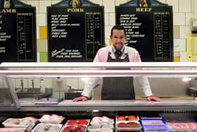 Kris Moore, who owns John Ross Butchers in the indoor markets Food Hall.