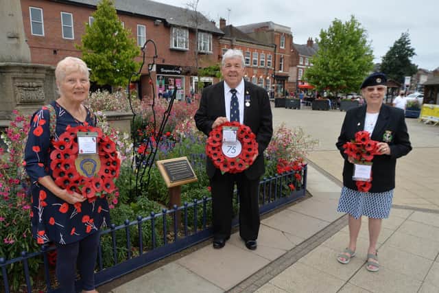 Jill Mann vice chairman of Market Harborough Royal British Legion, Stewart Harrison chairman of Market Harborough Royal British Legion and Pat Middleton chairman of the Royal Naval Association during the wreath laying for VJ Day.
PICTURE: ANDREW CARPENTER