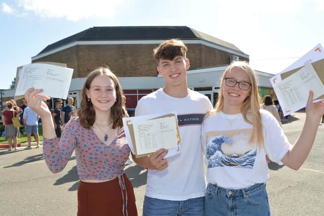 Class act...Kesia Floyd, Matthew Reeves and Eve Townsley celebrate their GCSE results at Welland Park Academy.
PICTURE: ANDREW CARPENTER