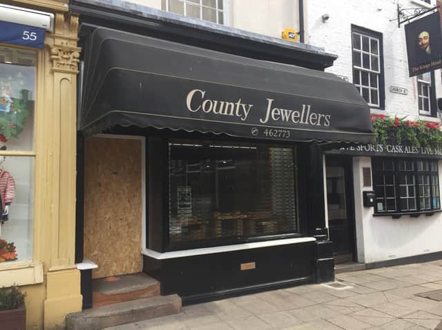 The hit and run gang used a motorbike, an axe and other “implements” to ram down the front door and storm into County Jewellers on the town’s High Street.