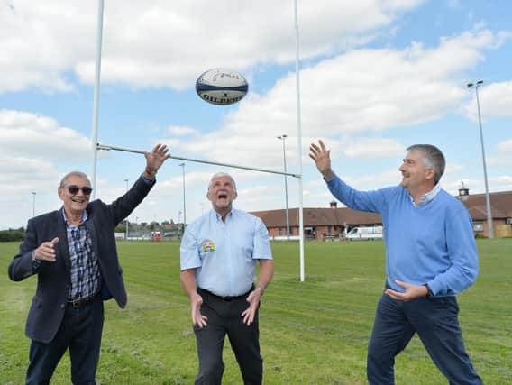 Boost...centre, Martin Dyke (commercial director of Market Harborough Rugby Club) with chairman John Gilding and treasurer David Mugridge of The League of Friends of Market Harborough Hospitals Charity.
PICTURE: ANDREW CARPENTER