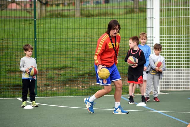 Coach Vicky Gallagher teaches basketball to youngsters.
PICTURE: ANDREW CARPENTER