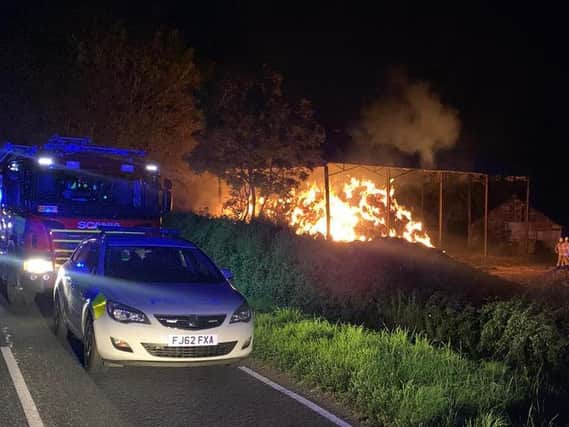 The devastating blaze ripped through the open-sided barn in an outlying field on Langton Hall Farm on West Langton Road, West Langton.