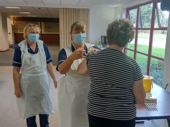 More than 500 people have attended a mass flu vaccination and had free eye tests at Harborough Leisure Centre in Market Harborough.