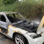 A driver escaped uninjured after their car burst into flames near Market Harborough.