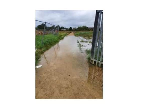 A footpath on a new Market Harborough estate is flooding again after repeated problems during heavy rain last winter.