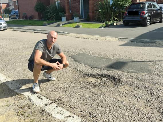 Craig Hartwell is still recovering after he accidentally rolled his kids petrol quad bike on top of him in the two-foot wide pothole just feet from his home in Limner Street.