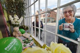 Raising a mug...Gail Devereux-Batchelor of Home Instead with Eunice Loney of Market Harborough Group of Macmillan Cancer Support outside the Macmillan dressed window at HomeInstead on St Mary's Road..
PICTURE: ANDREW CARPENTER