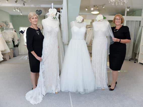 Jeanette Reid and Debbie Taylor inside Wedding Belles dress shop celebate its 30th Anniversary in Kibworth.
PICTURE: ANDREW CARPENTER