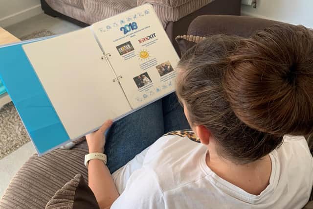 Reading the life story book.
