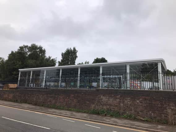 A veteran councillor has slammed the move to put new cycle pods in the front car park at Market Harborough railway station.