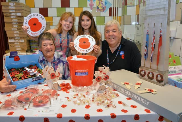 Poppy Appeal launch...Kathy Morley, Molly Leeder 10, Ruby Houston 9 and Stewart Harrison at Harborough indoor market on Saturday.
PICTURE: ANDREW CARPENTER