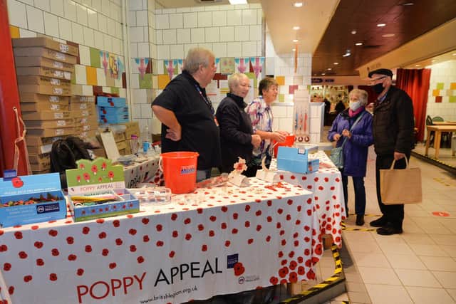 The Market Harborough poppy appeal stall at the indoor market.
PICTURE: ANDREW CARPENTER