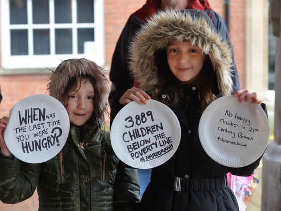 Violet Woodiwiss 7 and Willow Woodiwiss 9 during the free school meals demonstration under the Old Grammar School on Saturday.
PICTURE: ANDREW CARPENTER
