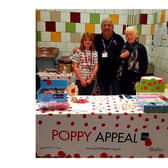 Stewart Harrison, chairman of the Market Harborough branch of the RBL, and his family at their poppy stall.