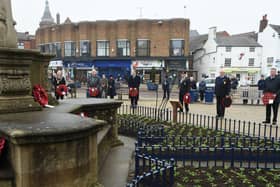Wreath carriers gather around the memorial on the Square.
PICTURE: ANDREW CARPENTER