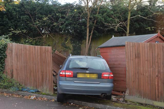 A car crahed through fence into a garden on Britannia Walk in Market Harborough.
PICTURE: ANDREW CARPENTER