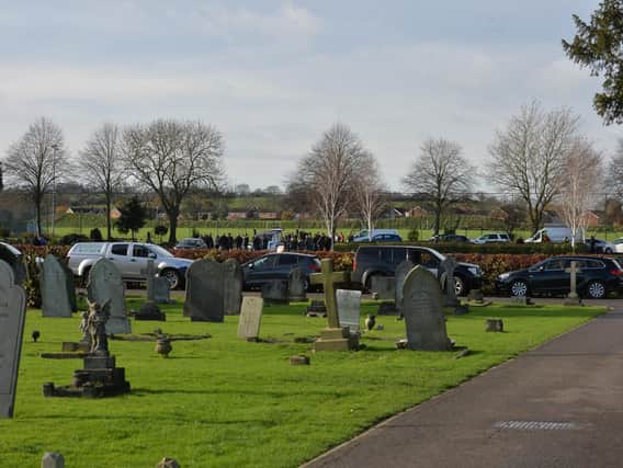 Family and friends pay their respects during the Diamond Price funeral in Market Harborough.