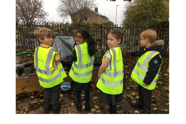 A group of pupils at Ridgeway Primary Academy with their high-vis vests donated by David Wilson Homes