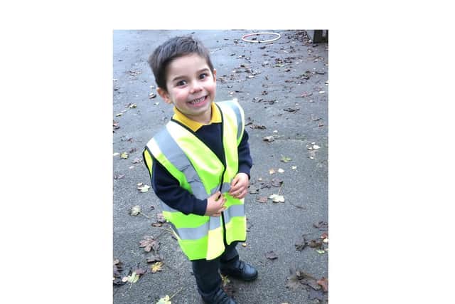 A pupil at Ridgeway Primary Academy wearing her high-vis vest for Road Safety Week.
