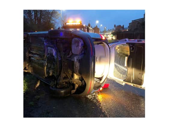 The Ford Galaxy flipped over on the A4304 in Husbands Bosworth after apparently clipping a lamp-post in atrocious wintry weather on Friday afternoon (December 4).
