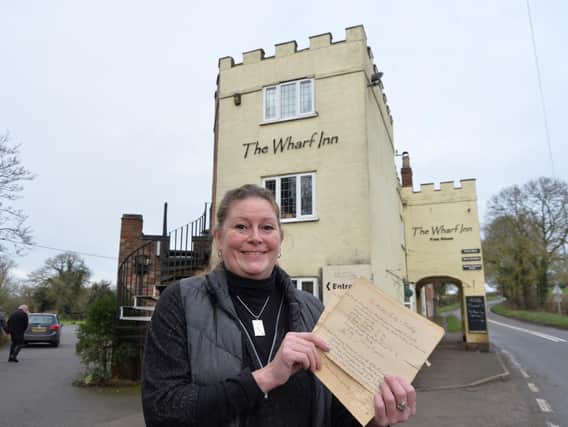 Anna Raven with the 129-year-old letter.
PICTURE: ANDREW CARPENTER