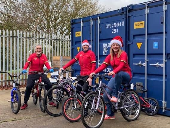 Keith Low, Paul Simpson, Sarah Young with some of the bikes that KER have gifted to youngsters this Christmas