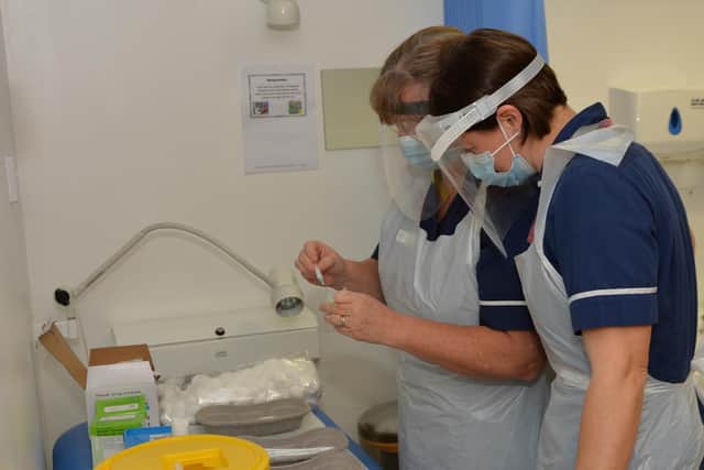 Practice nurses prepare the covid vaccine at Harborough Medical Centre.
PICTURE: ANDREW CARPENTER