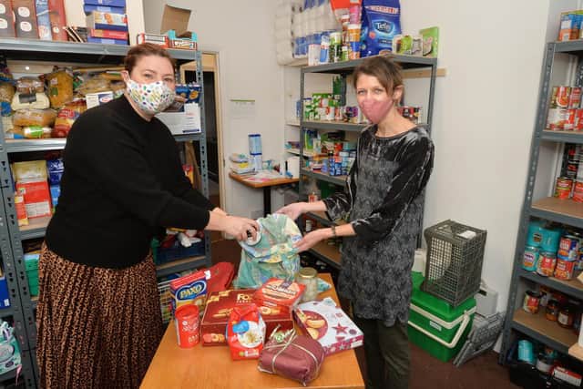 Caroline Geddes food bank volunteer and Emma Dowman centre manager in the Well food bank.
PICTURE: ANDREW CARPENTER