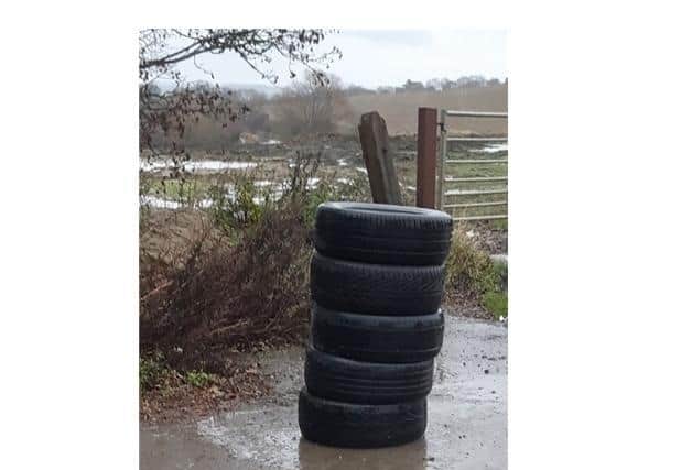 A man who dumped worn-out tyres in a country lane in Harborough has been fined £400 after he was caught red-handed.