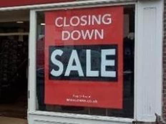 Four members of staff have lost their jobs after the Edinburgh Woollen Mill store on The Square has closed.